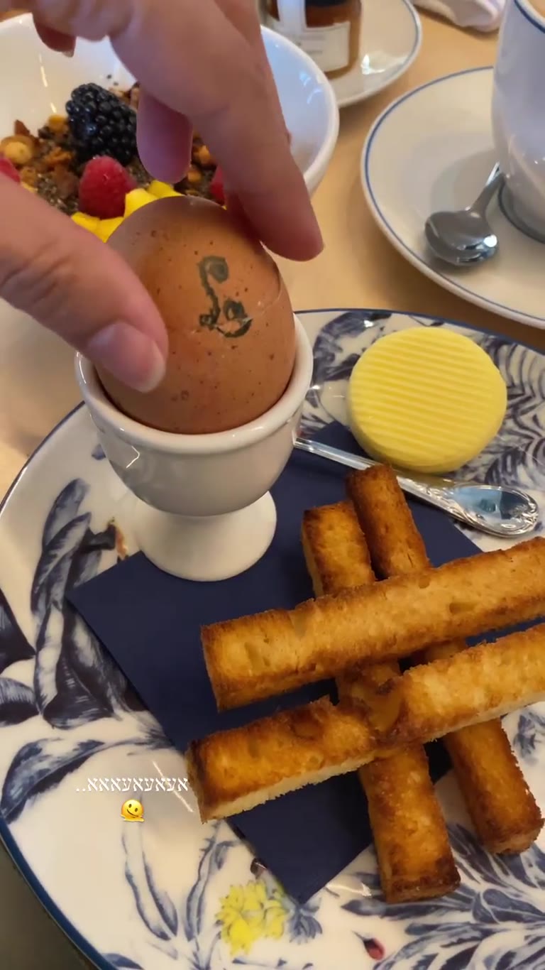 Soft-boiled egg breakfast with toast soldiers