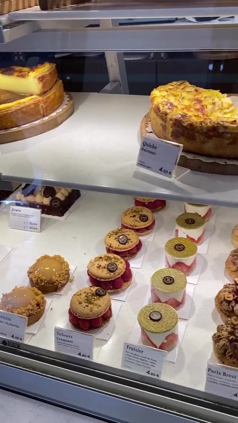 Paris bakery display: quiches, tartes & éclairs