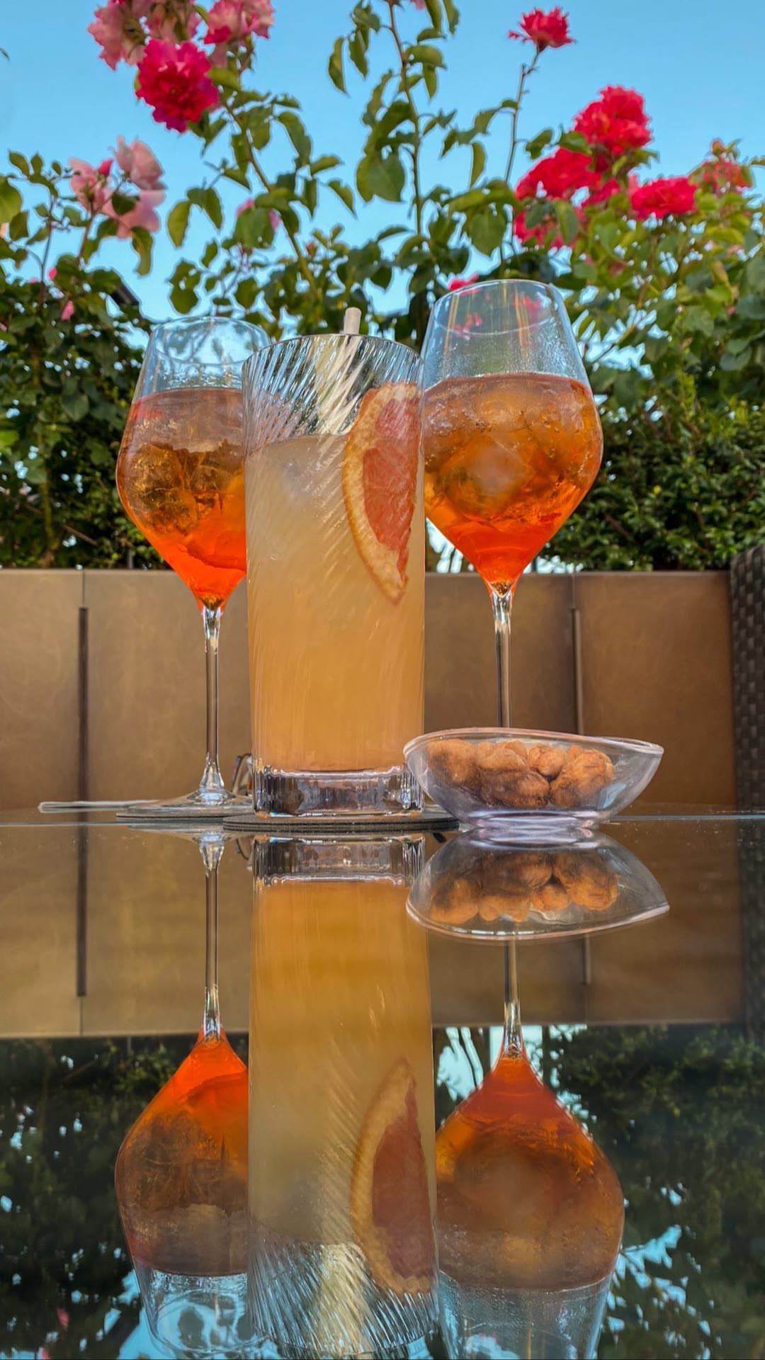 Spritz hour on a rose-filled terrace