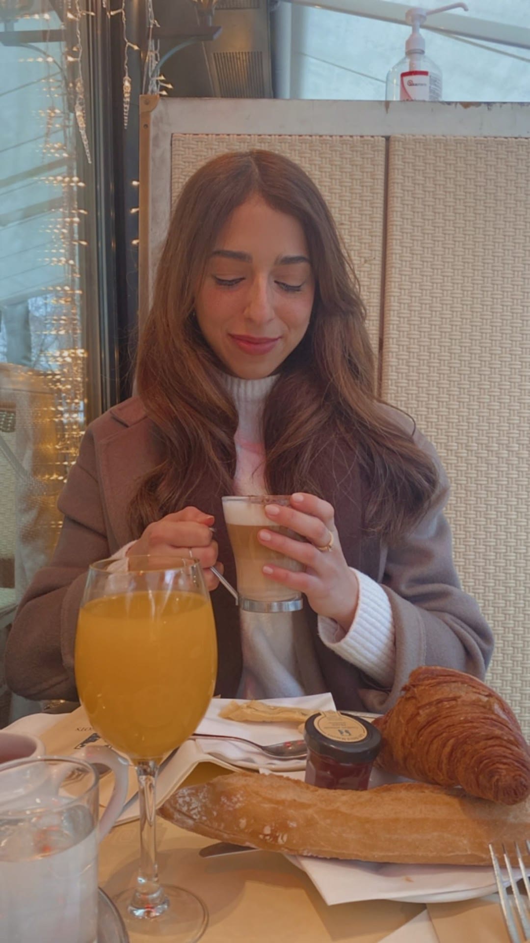 Parisian café breakfast with croissant and latte