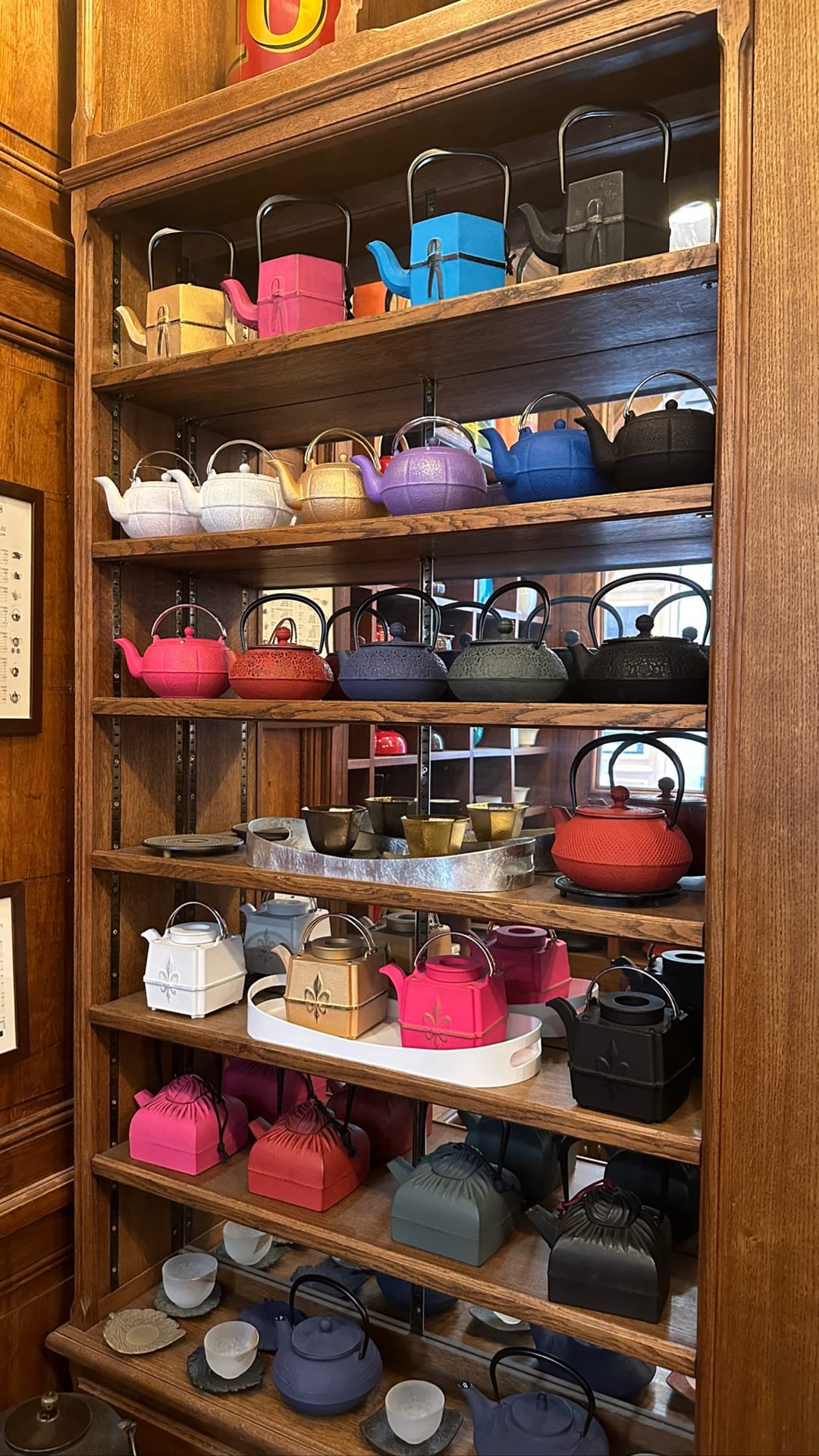 Cast-iron teapot wall at a Paris tea salon